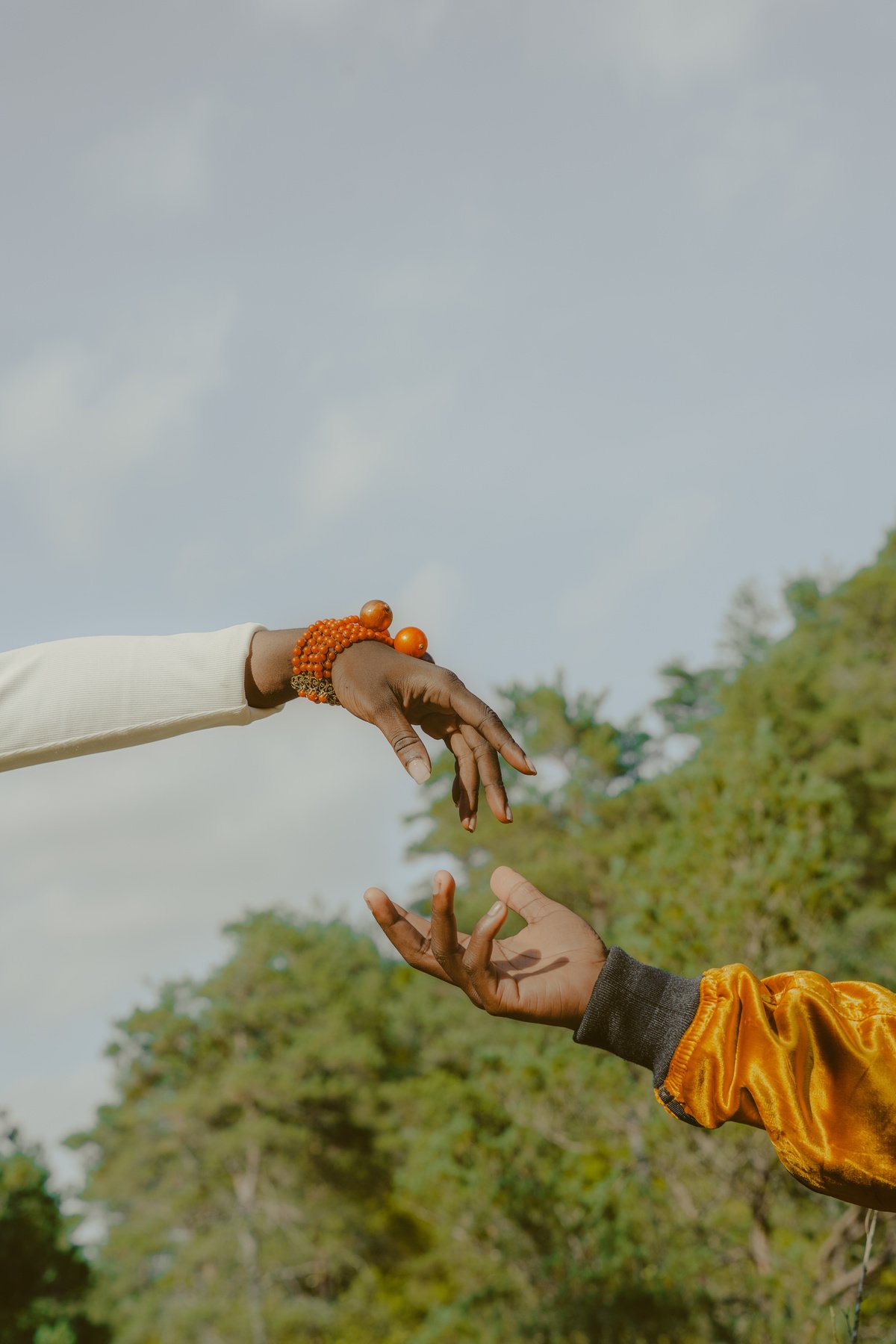 Hands Reaching Out to Each Other